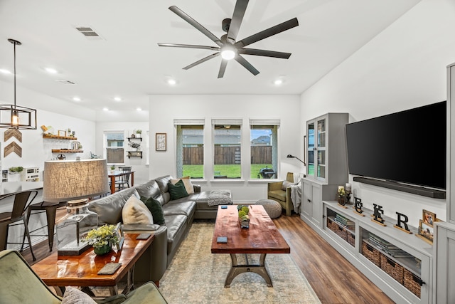 1224 Caprock Dr, Forney, TX 75126 - living area with wood finished floors, a ceiling fan, and recessed lighting