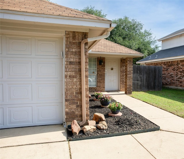 8713 Sabinas Trl, Fort Worth, TX 76118 - property entrance featuring a shingled roof and brick siding