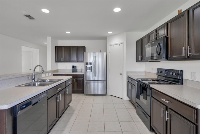 4506 Maplewood Ave, Balch Springs, TX 75180 - kitchen featuring black appliances, a sink, dark brown cabinets, light countertops, and recessed lighting