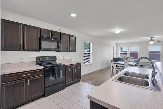 4506 Maplewood Ave, Balch Springs, TX 75180 - kitchen with black appliances, a sink, light countertops, dark brown cabinets, and recessed lighting