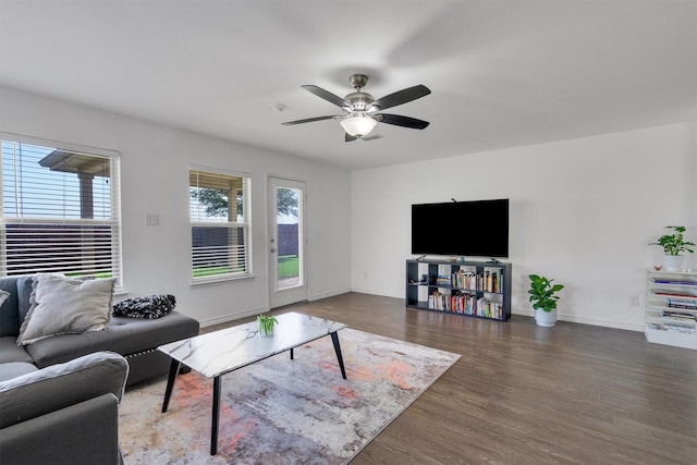 4506 Maplewood Ave, Balch Springs, TX 75180 - living area featuring wood finished floors, a ceiling fan, and baseboards