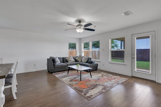 4506 Maplewood Ave, Balch Springs, TX 75180 - living room featuring ceiling fan, dark wood-style flooring, and baseboards