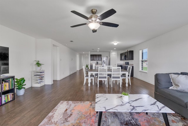 4506 Maplewood Ave, Balch Springs, TX 75180 - living area featuring dark wood finished floors, ceiling fan, and baseboards