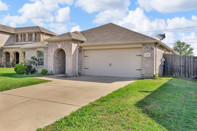 4506 Maplewood Ave, Balch Springs, TX 75180 - view of front of home with brick siding, an attached garage, driveway, and a shingled roof