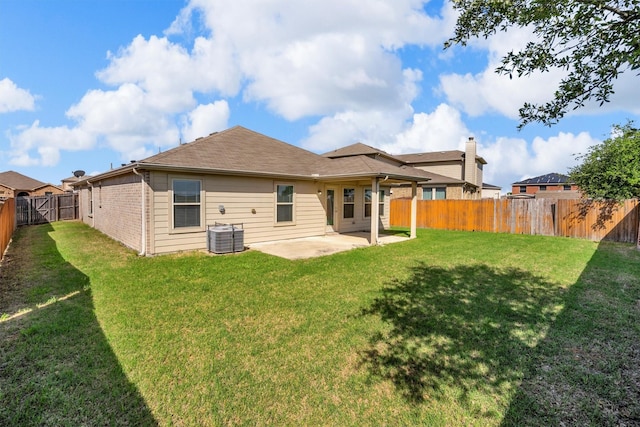 4506 Maplewood Ave, Balch Springs, TX 75180 - back of property with a patio and central AC
