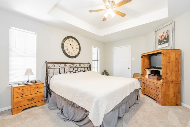 2120 Lisa Cir, Canton, TX 75103 - bedroom featuring light carpet, baseboards, and a tray ceiling