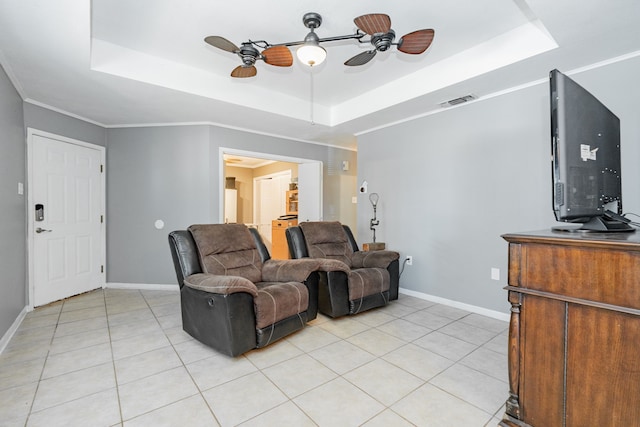 2120 Lisa Cir, Canton, TX 75103 - living room with a ceiling fan, a tray ceiling, light tile patterned flooring, and baseboards