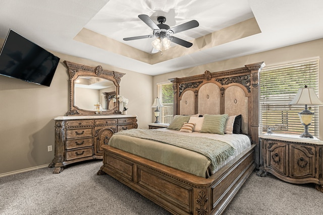 105 Mission Crest Cir, Lindale, TX 75771 - bedroom with light colored carpet, a tray ceiling, baseboards, and ceiling fan