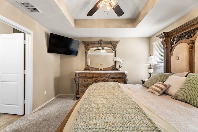 105 Mission Crest Cir, Lindale, TX 75771 - bedroom with baseboards, a ceiling fan, a raised ceiling, and light carpet