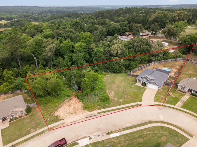105 Mission Crest Cir, Lindale, TX 75771 - aerial view of property and surrounding area with property parcel outlined and a forest