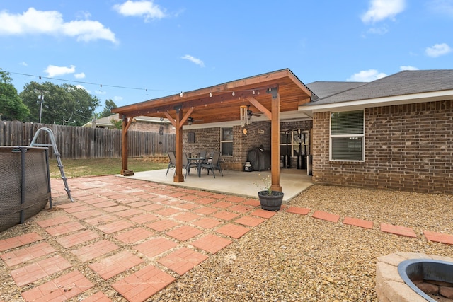 105 Mission Crest Cir, Lindale, TX 75771 - fenced backyard with a patio area and a ceiling fan