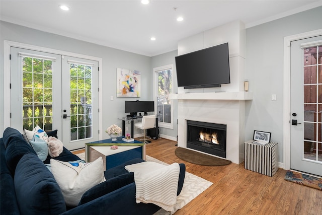 3702 Holland Ave Unit 1, Dallas, TX 75219 - living room with french doors, a premium fireplace, light wood-style floors, recessed lighting, and baseboards