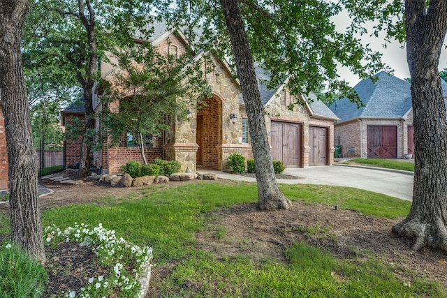 3420 Grayson Ct, Hurst, TX 76054 - view of front of property with concrete driveway, brick siding, an attached garage, and stone siding