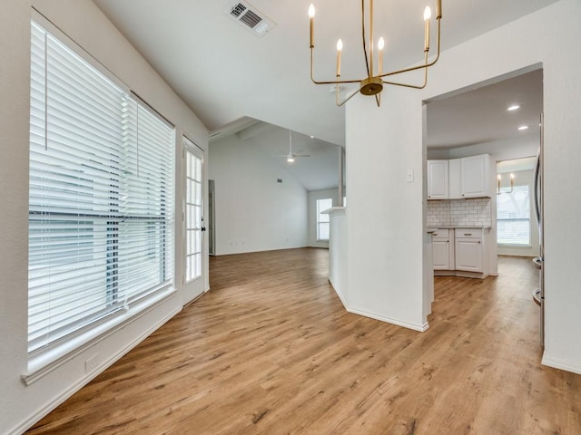 820 Arbor Downs Dr, Plano, TX 75023 - unfurnished living room with a chandelier, plenty of natural light, light wood finished floors, and ceiling fan