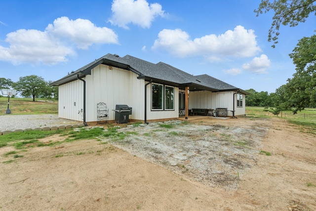 3385 Dps Tower Rd, Perrin, TX 76486 - rear view of property with board and batten siding and a shingled roof