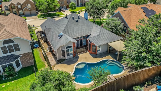 5709 Courtney Cir, Haltom City, TX 76137 - back of house with a shingled roof, a fenced backyard, a residential view, and a patio area