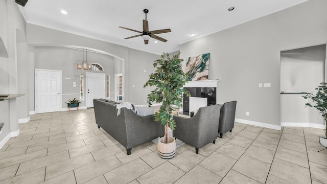 5709 Courtney Cir, Haltom City, TX 76137 - living area featuring arched walkways, a ceiling fan, a chandelier, light tile patterned floors, and recessed lighting