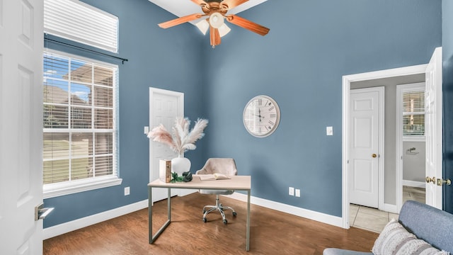 5709 Courtney Cir, Haltom City, TX 76137 - office space featuring a towering ceiling, ceiling fan, baseboards, and plenty of natural light