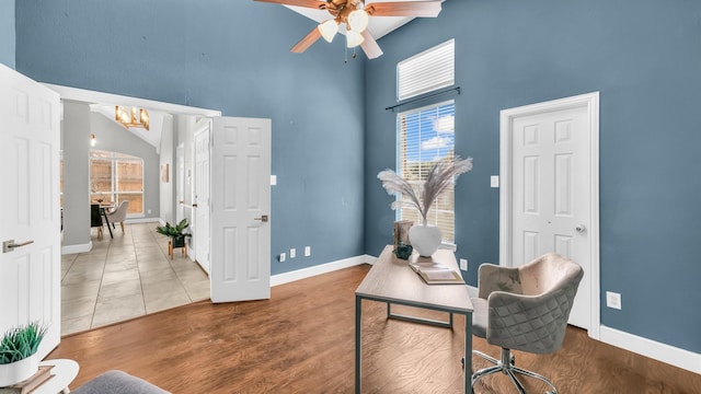 5709 Courtney Cir, Haltom City, TX 76137 - office area with high vaulted ceiling, a chandelier, a ceiling fan, baseboards, and wood finished floors