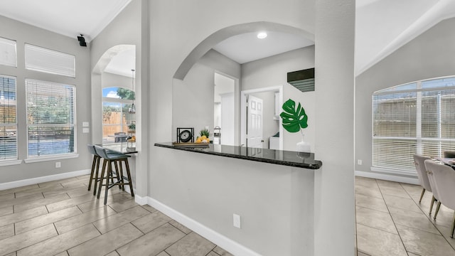 5709 Courtney Cir, Haltom City, TX 76137 - kitchen featuring arched walkways and baseboards