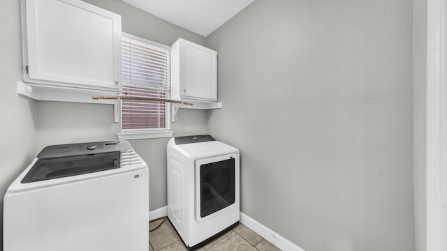 5709 Courtney Cir, Haltom City, TX 76137 - washroom with cabinet space, independent washer and dryer, light tile patterned flooring, and baseboards