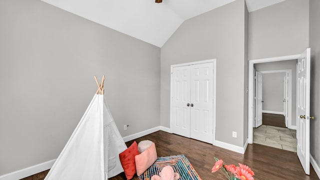 5709 Courtney Cir, Haltom City, TX 76137 - playroom featuring vaulted ceiling, baseboards, and wood finished floors