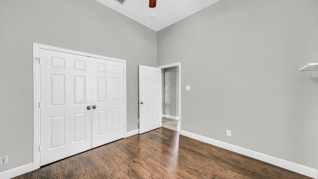 5709 Courtney Cir, Haltom City, TX 76137 - unfurnished bedroom featuring high vaulted ceiling, baseboards, wood finished floors, a closet, and ceiling fan