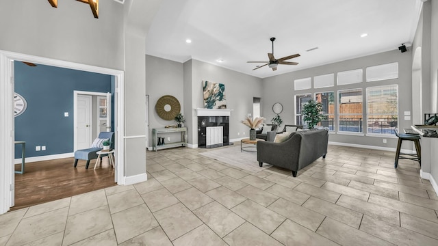 5709 Courtney Cir, Haltom City, TX 76137 - living room featuring ceiling fan, baseboards, recessed lighting, light tile patterned flooring, and a fireplace