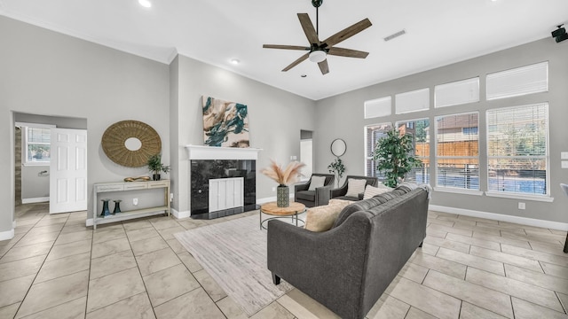 5709 Courtney Cir, Haltom City, TX 76137 - living area featuring a ceiling fan, baseboards, light tile patterned flooring, recessed lighting, and ornamental molding