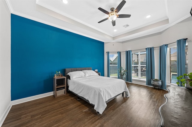 386 Cavitt Ct, Robinson, TX 76706 - bedroom featuring a raised ceiling, wood finished floors, crown molding, recessed lighting, and baseboards