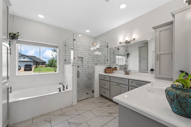 386 Cavitt Ct, Robinson, TX 76706 - full bathroom featuring vanity, a garden tub, a shower stall, recessed lighting, and marble look tile flooring