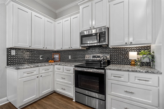 386 Cavitt Ct, Robinson, TX 76706 - kitchen with appliances with stainless steel finishes, ornamental molding, decorative backsplash, white cabinets, and dark wood-style flooring