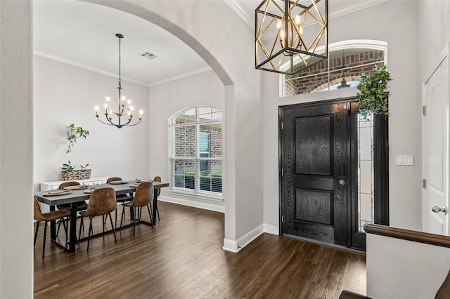 386 Cavitt Ct, Robinson, TX 76706 - foyer with a chandelier, dark wood-type flooring, arched walkways, ornamental molding, and baseboards
