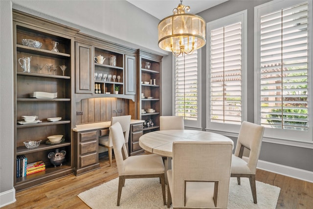 6286 Brentway Rd, Frisco, TX 75034 - dining space featuring light wood-style floors, a chandelier, an office area, and baseboards