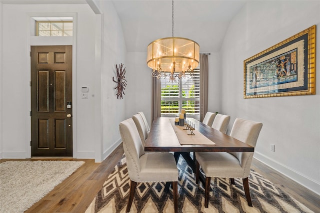 6286 Brentway Rd, Frisco, TX 75034 - dining space with a chandelier, wood finished floors, baseboards, and vaulted ceiling