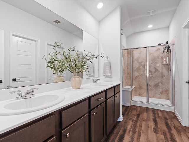 4148 Agatha Ln, Celina, TX 76227 - full bath with double vanity, a stall shower, wood finished floors, and recessed lighting