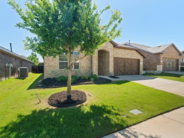 4148 Agatha Ln, Celina, TX 76227 - view of front of house with central AC, brick siding, an attached garage, and concrete driveway