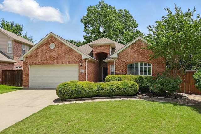 736 Kilbridge Ln, Coppell, TX 75019 - traditional home featuring an attached garage, brick siding, driveway, and roof with shingles