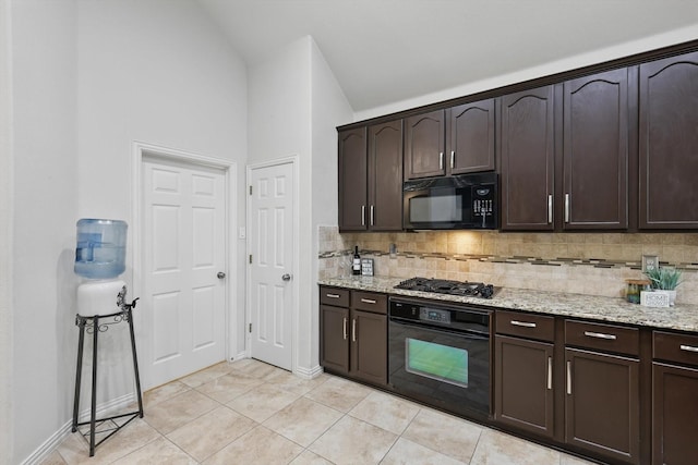 736 Kilbridge Ln, Coppell, TX 75019 - kitchen with black appliances, backsplash, dark brown cabinetry, light stone counters, and lofted ceiling
