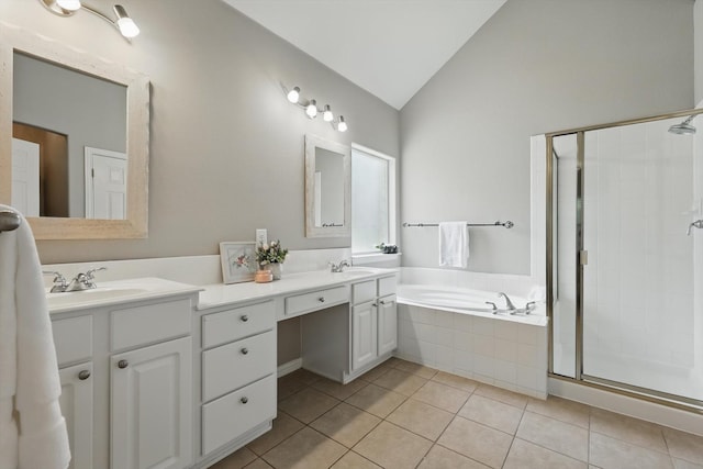 736 Kilbridge Ln, Coppell, TX 75019 - bathroom featuring lofted ceiling, double vanity, a shower stall, tile patterned floors, and a garden tub