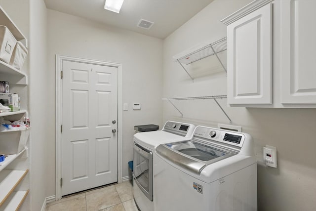 736 Kilbridge Ln, Coppell, TX 75019 - laundry area featuring washing machine and clothes dryer, cabinet space, light tile patterned floors, and baseboards