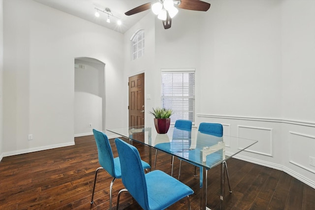 736 Kilbridge Ln, Coppell, TX 75019 - dining area featuring hardwood / wood-style flooring, a ceiling fan, arched walkways, baseboards, and a wainscoted wall