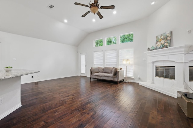 736 Kilbridge Ln, Coppell, TX 75019 - living area featuring a ceiling fan, dark wood finished floors, high vaulted ceiling, a high end fireplace, and baseboards