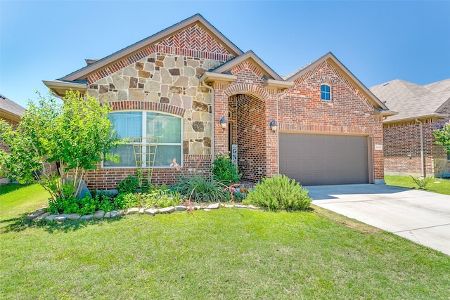 4012 Gennaker Dr, Denton, TX 76210 - view of front facade with a front lawn, driveway, brick siding, stone siding, and a garage