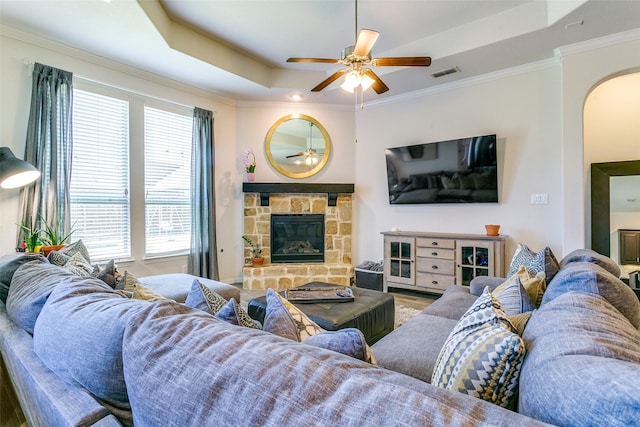 4012 Gennaker Dr, Denton, TX 76210 - living area with a raised ceiling, arched walkways, plenty of natural light, and crown molding