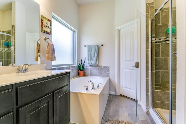 4012 Gennaker Dr, Denton, TX 76210 - bathroom with a shower stall, vanity, and a garden tub