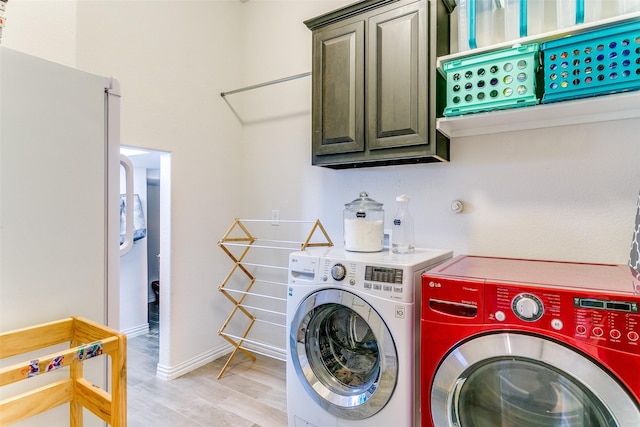 4012 Gennaker Dr, Denton, TX 76210 - laundry room with washer and dryer, light wood-type flooring, and cabinet space