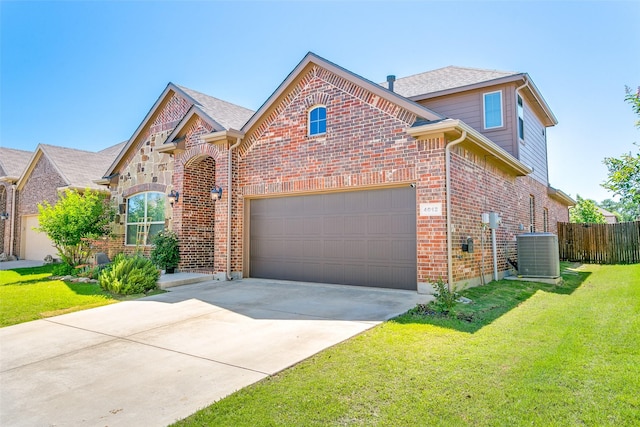 4012 Gennaker Dr, Denton, TX 76210 - view of front of house featuring a garage, concrete driveway, and brick siding