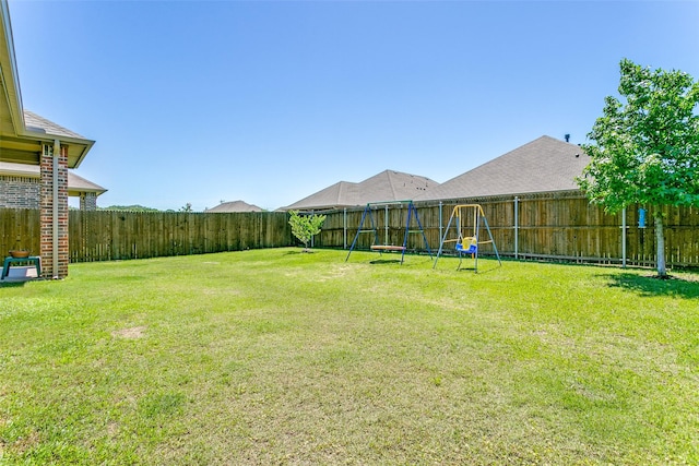 4012 Gennaker Dr, Denton, TX 76210 - fenced backyard with a playground