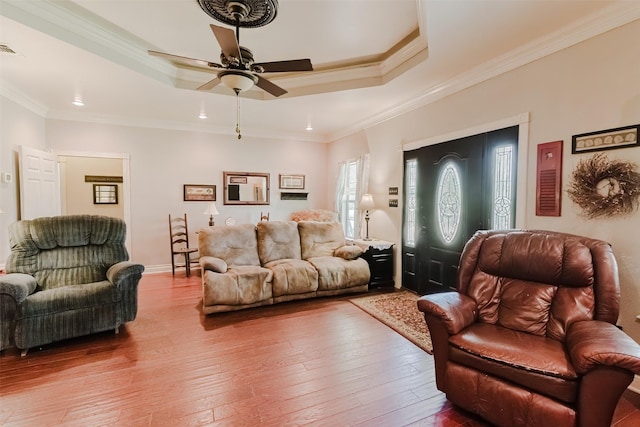 239 County Road 3586, Paradise, TX 76073 - living room with a raised ceiling, a ceiling fan, hardwood / wood-style floors, and crown molding